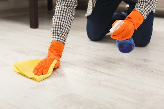 unrecognizable-man-washing-floor-with-towel-detergents-living-room-housekeeping-home-cleaning-cleaning-service-concept-copy-space_116547-3680